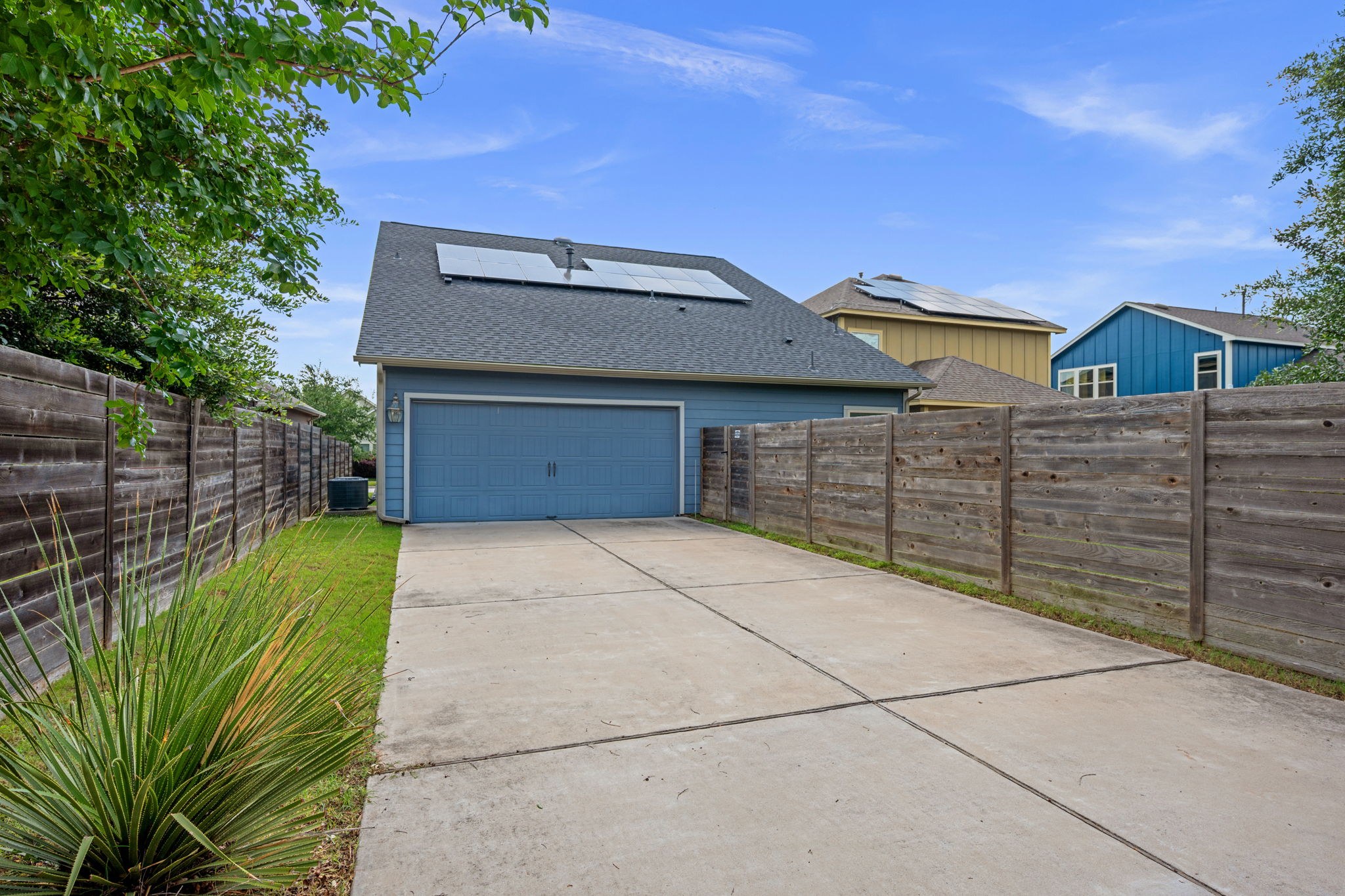 8800 Slater Drive Austin, TX 78747 - Photo 30 of 40 a front view of a house with a garage and yard