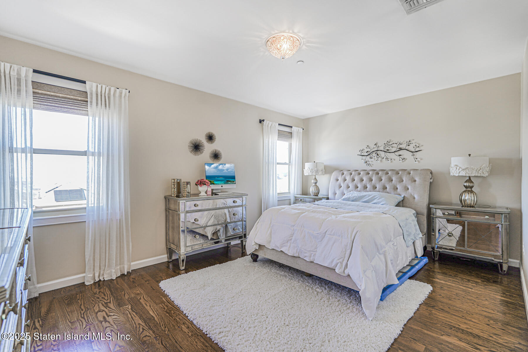 1352 Forest Hill Road Staten Island, NY 10314 - Photo 15 of 19 a bedroom with a bed and a dresser