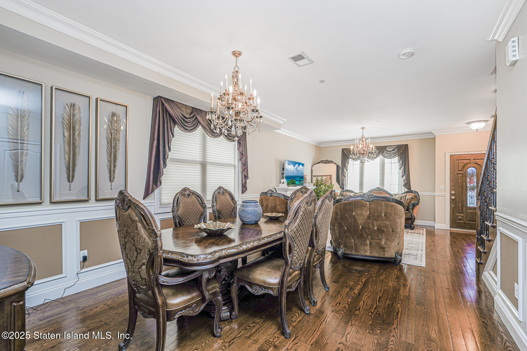 1352 Forest Hill Road Staten Island, NY 10314 - Photo 5 of 19 a dining room with furniture a chandelier and wooden floor