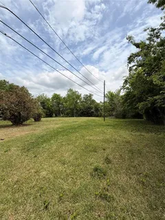 a view of outdoor space with deck and yard