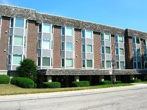 a view of a building with a yard