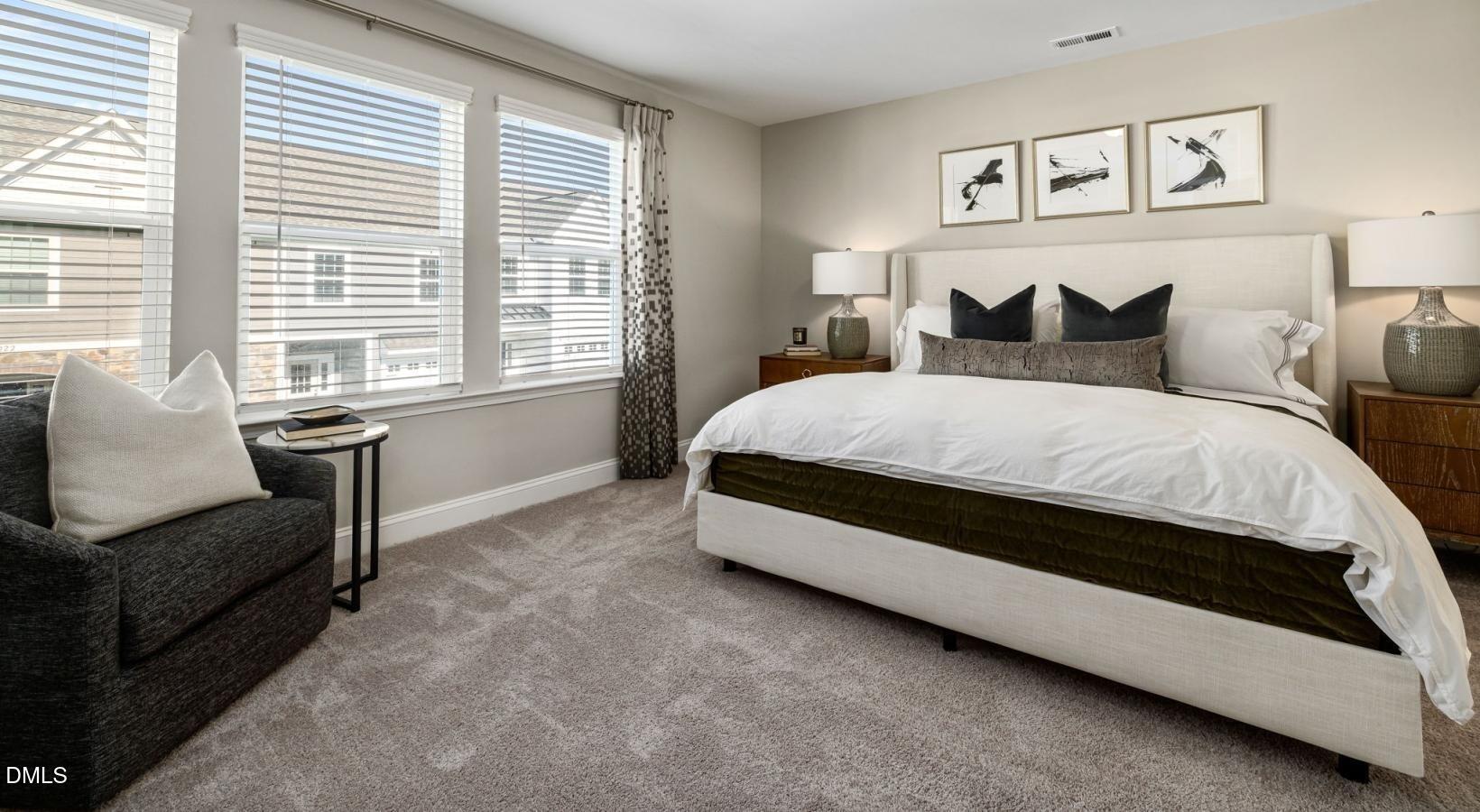 556 Hatters Mill Road, Unit JAMESON Wake Forest, NC 27587 - Photo 5 of 12 a bedroom with a bed and a couch