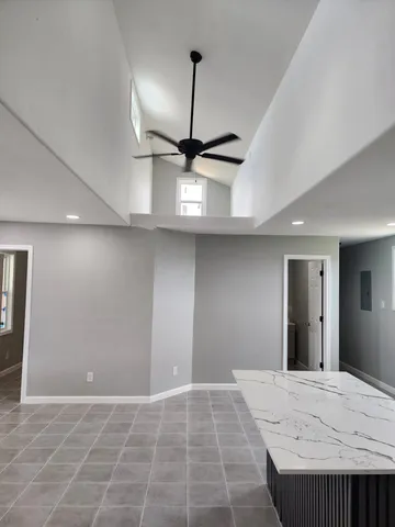 a view of a kitchen with a sink and a window