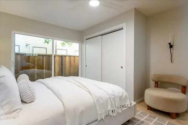 a bedroom with a bed and a couch