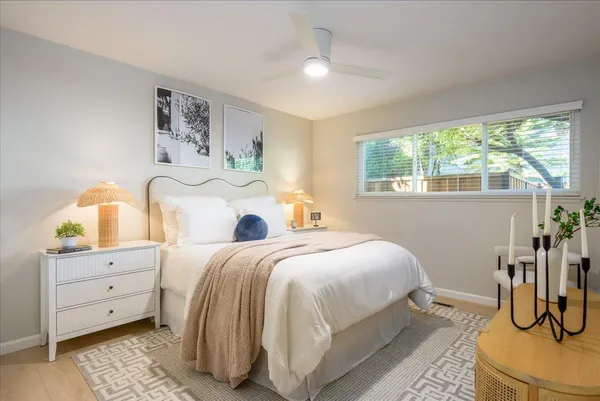 a bedroom with a bed and window