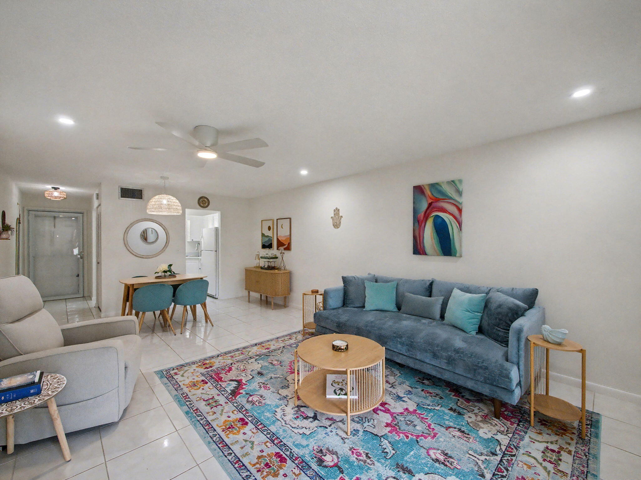 1967 Southwest Palm City Road, Unit 34C Stuart, FL 34994 - Photo 6 of 25 a living room with furniture and a rug