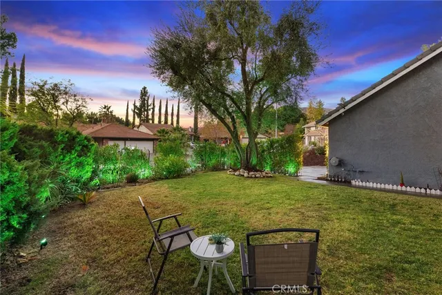 a living room with furniture dining table and a large window