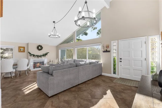 a dining room with furniture a window and a chandelier