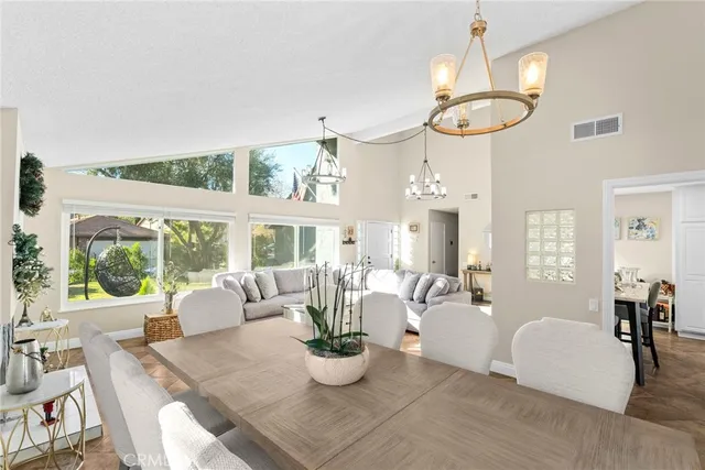 a kitchen with stainless steel appliances granite countertop a refrigerator a stove a sink a counter space and cabinets