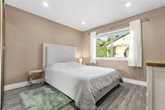 a view of a patio with table and chairs with wooden fence