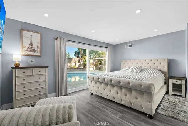 a front view of a house with yard and green space