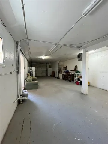 a view of parking garage with cars