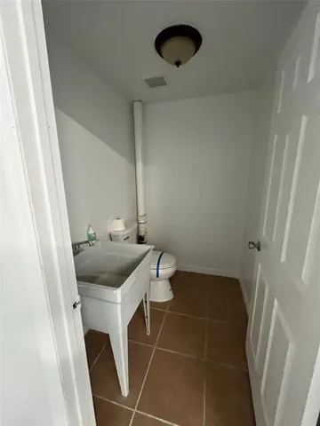 a bathroom with a sink and toilet