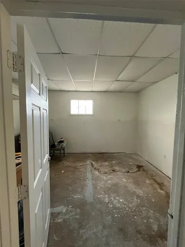 a view of an empty room and a window