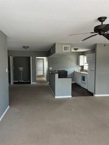 a view of a kitchen with a sink