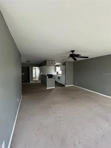 a view of empty room with furniture