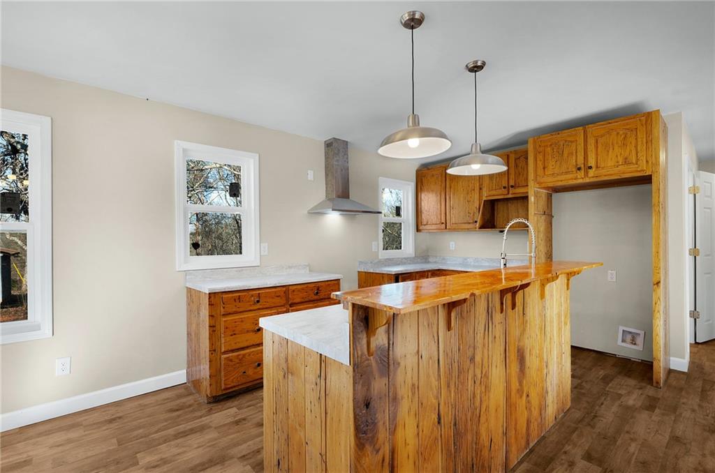 78 Ridgeback Road Talking Rock, GA 30175 - Photo 11 of 35 a kitchen with stainless steel appliances granite countertop a sink a refrigerator a stove and a wooden floors