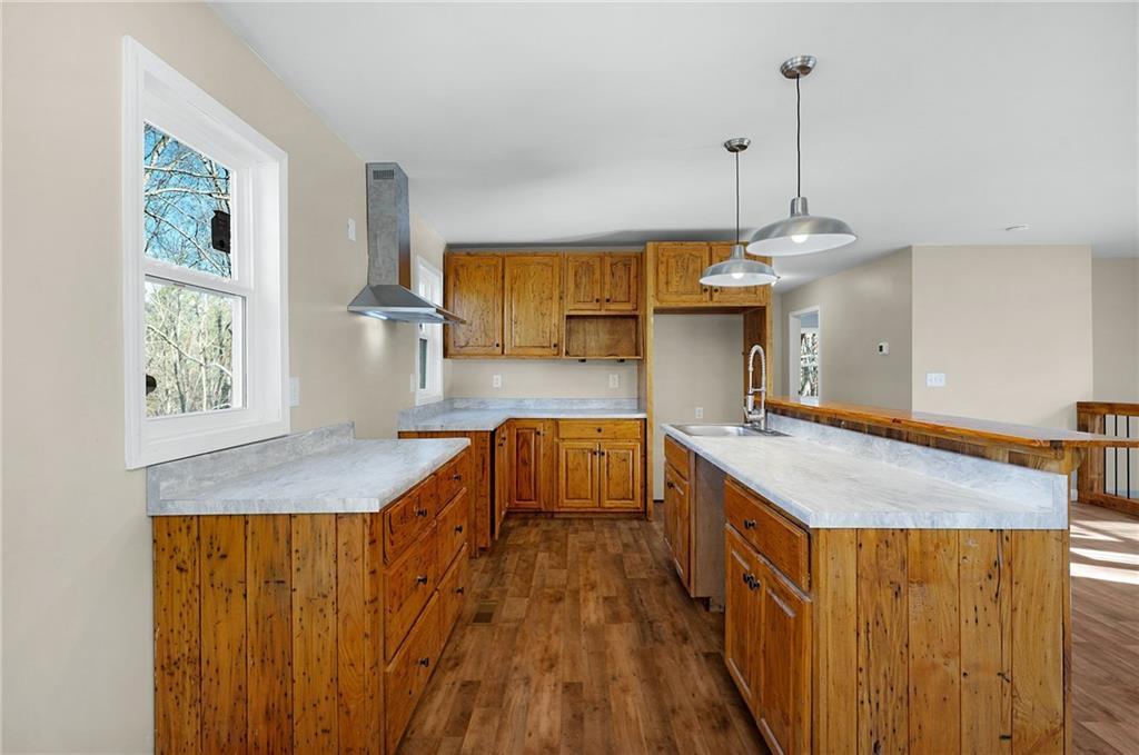 78 Ridgeback Road Talking Rock, GA 30175 - Photo 13 of 35 a kitchen with stainless steel appliances granite countertop a sink a stove and a wooden floors
