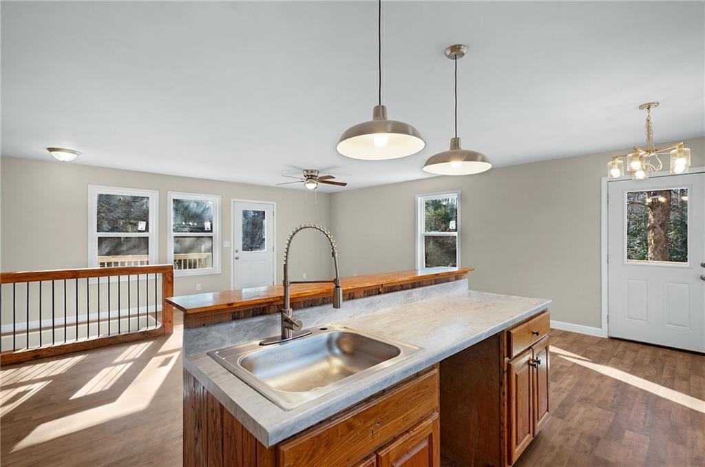 78 Ridgeback Road Talking Rock, GA 30175 - Photo 15 of 35 a kitchen with a sink a stove and a table