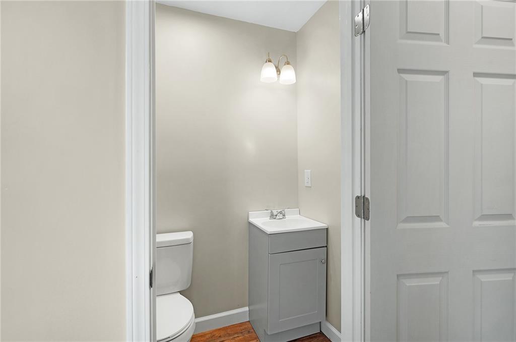 78 Ridgeback Road Talking Rock, GA 30175 - Photo 16 of 35 a bathroom with a toilet a sink and mirror