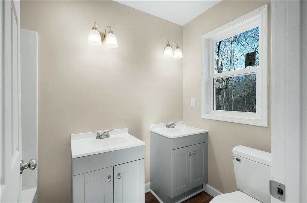 78 Ridgeback Road Talking Rock, GA 30175 - Photo 19 of 35 a bathroom with a toilet sink and mirror