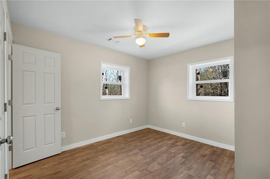 78 Ridgeback Road Talking Rock, GA 30175 - Photo 25 of 35 an empty room with wooden floor and window
