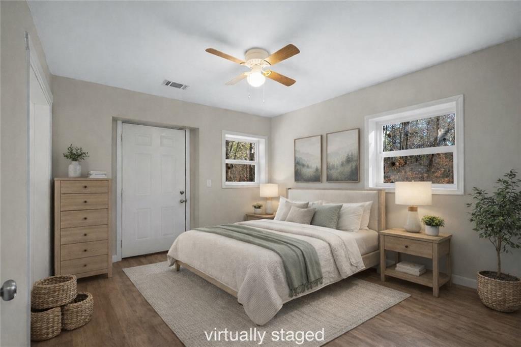 78 Ridgeback Road Talking Rock, GA 30175 - Photo 26 of 41 a bedroom with a large bed and a chandelier