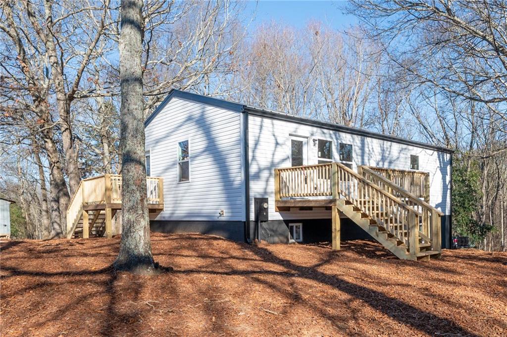 78 Ridgeback Road Talking Rock, GA 30175 - Photo 3 of 35 a front view of a house with a yard