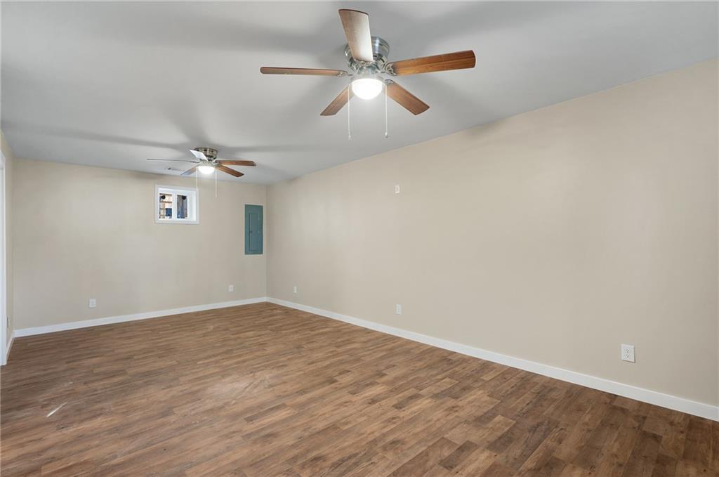 78 Ridgeback Road Talking Rock, GA 30175 - Photo 32 of 41 an empty room with wooden floor ceiling fan and window