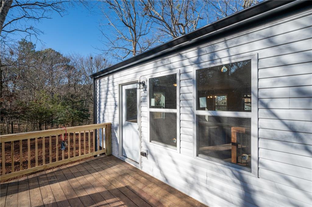 78 Ridgeback Road Talking Rock, GA 30175 - Photo 6 of 35 a view of a porch with a table and chairs