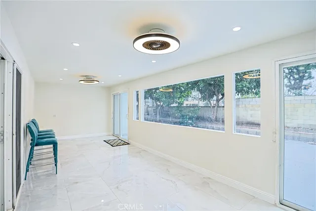 a view of a lobby with furniture and floor to ceiling window