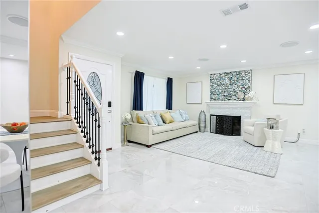 a view of a hallway with wooden floor and entryway