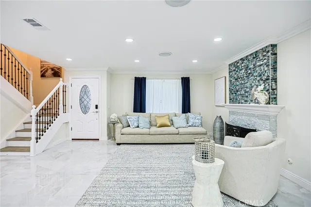 a living room with furniture and a painting