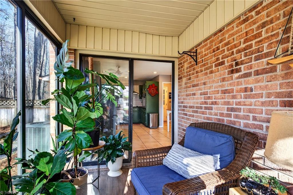 7736 Penns Grove Road Summerfield, NC 27358 - Photo 11 of 50 The sunroom is a great place to relax!