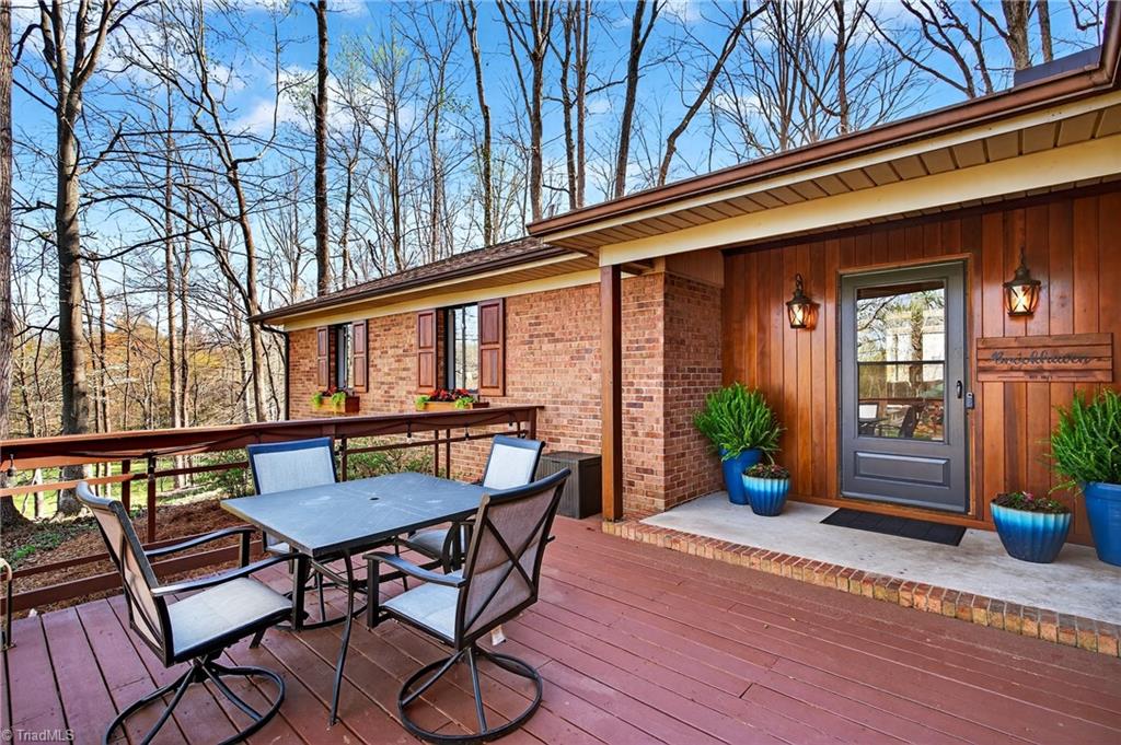 7736 Penns Grove Road Summerfield, NC 27358 - Photo 3 of 50 Front of home with deck overlooking the barn and pastures!