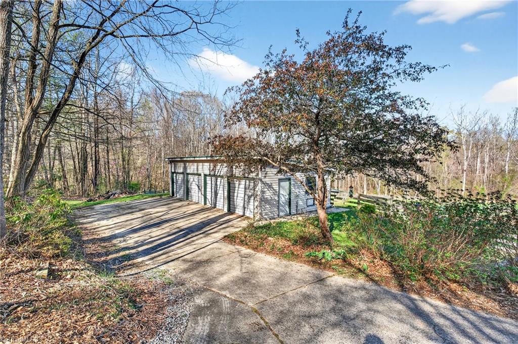 7736 Penns Grove Road Summerfield, NC 27358 - Photo 40 of 50 Detached 4 bay garage with temperature controlled storage/workout room!