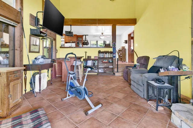 a living room with furniture a window and a table