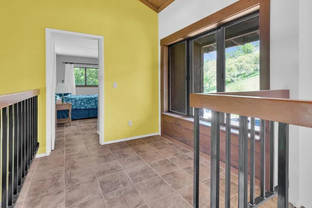 a bedroom that has a bed and a desk in it