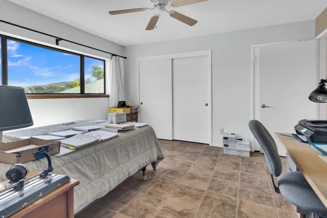 a workspace with furniture window and wooden floor
