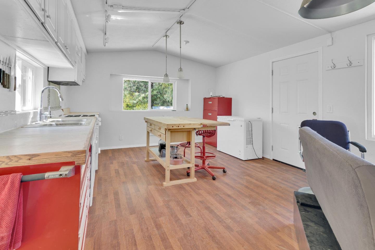 38483 Milpitas Road Greenfield, CA 93927 - Photo 37 of 55 a workspace with furniture window and wooden floor