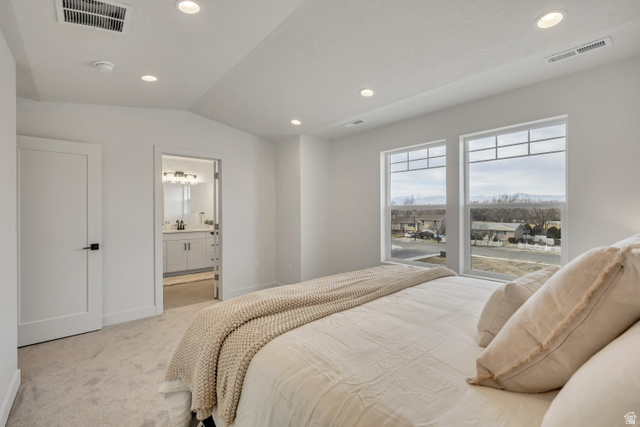 330 East 7635 S Street Sandy, UT 84047 - Photo 13 of 29 Bedroom featuring carpet flooring, vaulted ceiling, recessed lighting, and ensuite bath