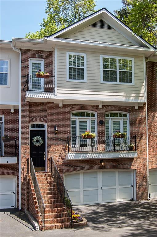 1133 Scott Boulevard, Unit 11 Decatur, GA 30030 - Photo 1 of 1 a front view of a house with barbeque and stairs