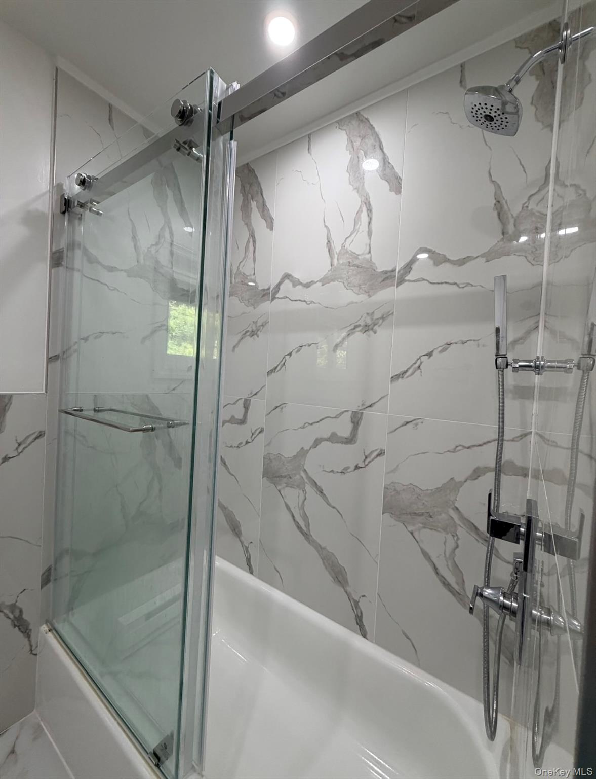 60 Medallion Road Kiamesha Lake, NY 12751 - Photo 28 of 44 a bathroom with a shower and a bath tub