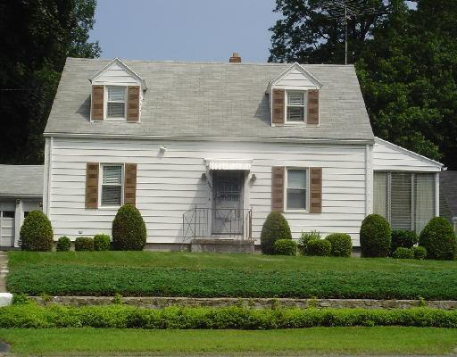 2896 Old Town Road Bridgeport, CT 06606 - Photo 1 of 1 a front view of a house with a garden and plants
