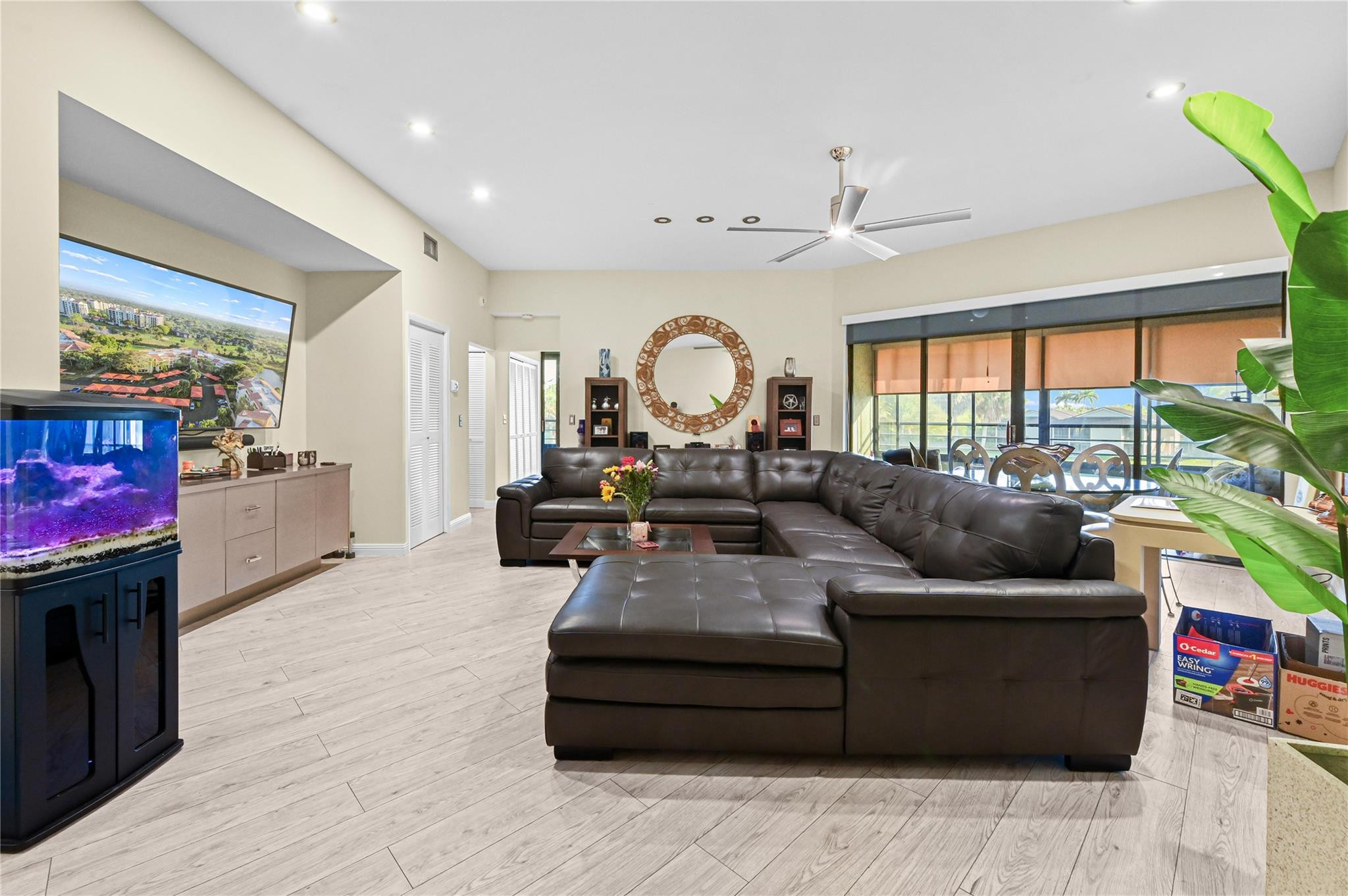 7520 La Paz Boulevard, Unit 306 Boca Raton, FL 33433 - Photo 5 of 36 a living room with furniture and a large window