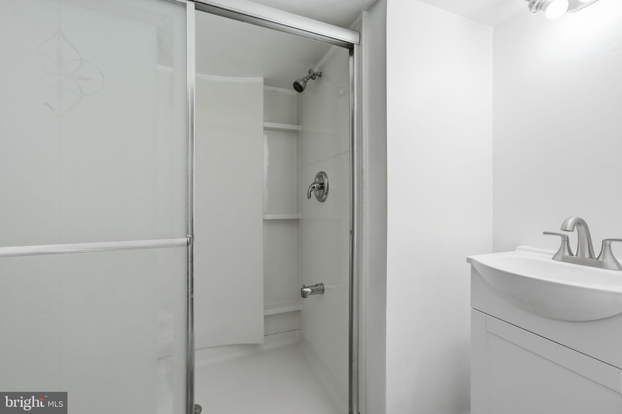 8260 Getty Court Springfield, VA 22153 - Photo 27 of 31 a bathroom with a sink and a mirror