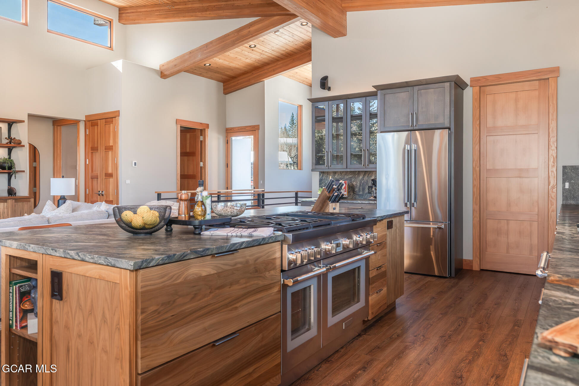 684 Vasquez Road Winter Park, CO 80482 - Photo 18 of 45 a kitchen with stainless steel appliances granite countertop a stove and a refrigerator