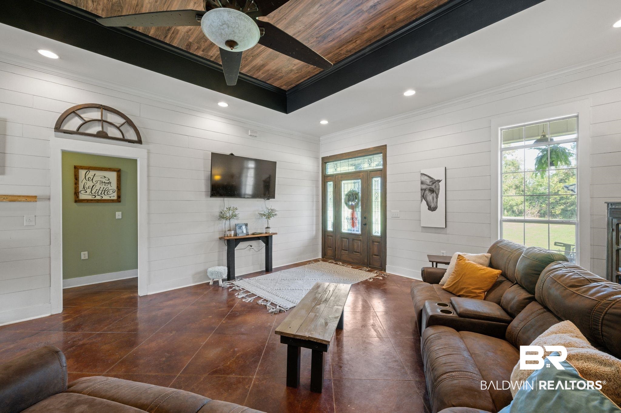 15635 North A N Brady Road Bay Minette, AL 36507 - Photo 10 of 51 Living room with wooden ceiling, ornamental molding, wooden walls, and ceiling fan
