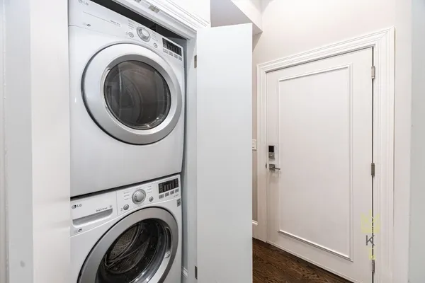 a view of a hallway with washer and dryer