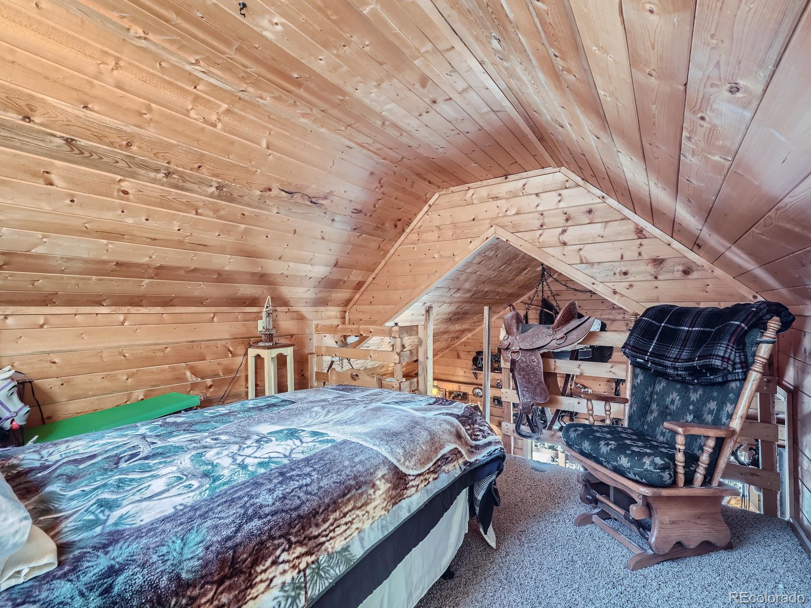 139 Hayes Street Bailey, CO 80421 - Photo 16 of 28 a roof deck with table and chairs